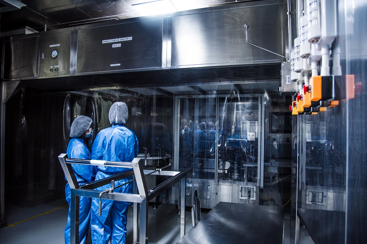 The team of professional medical representatives in vial filling room which is aimed to fill products into vials under A in B cleanroom environment at MU-Bio Innovation Building at Mahidol University, Salaya Campus